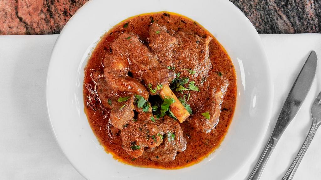53. Goat Curry · Goat with ginger, garlic, and special blend of spices.