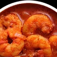 59. Prawns Vindaloo · Prawns curry with potatoes, spicy sauce, herbs, and spices.