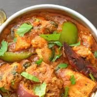 62. Fish Vindaloo · Fish curry, potatoes, spicy sauce, herbs, and spices.