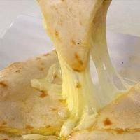 71. Cheese Naan · Soft bread stuffed with cheese freshly baked in tandoor.