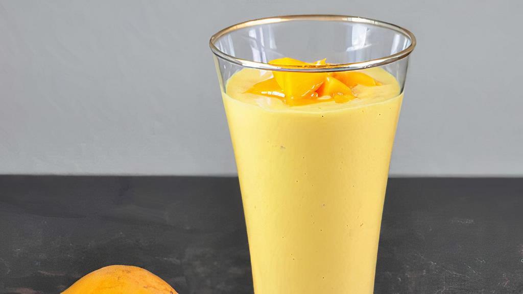 81. Mango Lassi · Mango and yogurt blended drink.