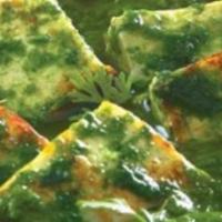 Chicken Saag · Hearty marinated chicken cooked with fresh green spinach and Indian spices.