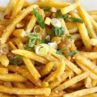 Garlic Fries · A Serving of Fries hand-tossed in Our house-made savory fresh garlic sauce and garnished wit...