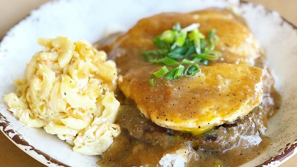 Janelle's Loco Moco · Delicious Hawaiian-styled dish with 2 House-made All-Beef patties and 2 fried eggs smothered with brown gravy.