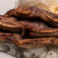 Kalbi Short Ribs · Our Korean-style short ribs marinated and grilled. Served with grilled onions.