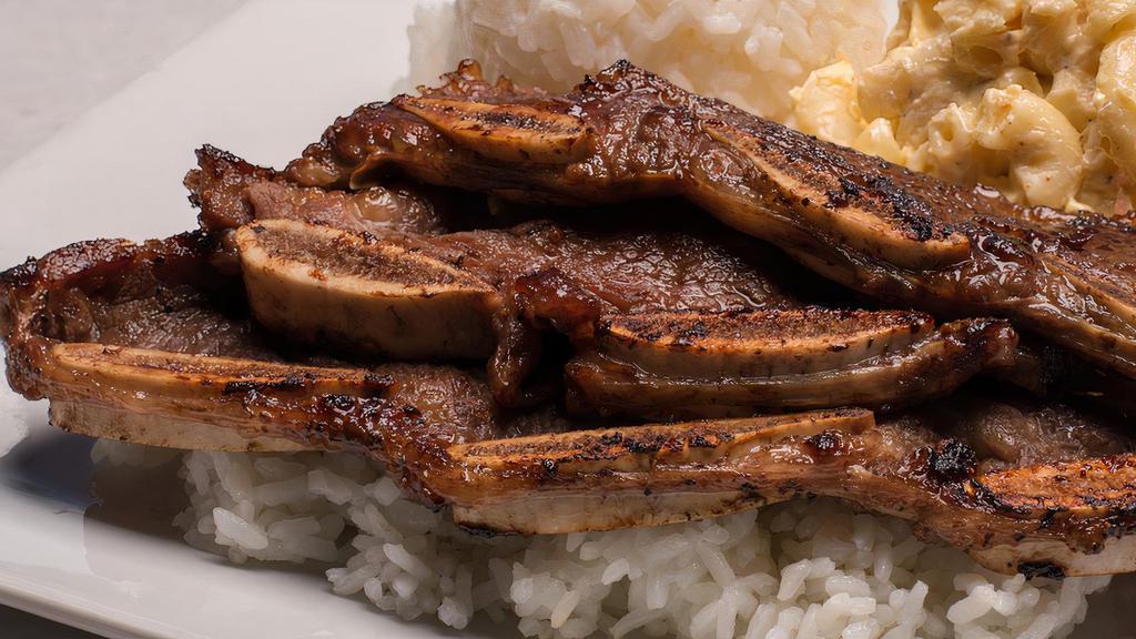 Kalbi Short Ribs · Our Korean-style short ribs marinated and grilled. Served with grilled onions.