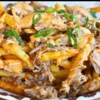 Hang Ten Fries · A Serving of Our Kalua Pork with Our Hang10 Aioli sauce drizzled all over a serving of fries...