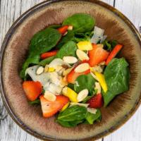 Spinach Salad · Baby spinach, strawberries, mango, almonds, and romano cheese.