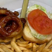 BBQ Burger 
 · Lettuce, tomato, pickle, bacon, cheddar, onion rings, and BBQ sauce. With choice of side..