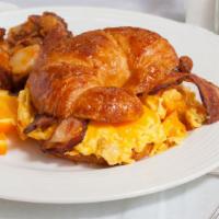 Breakfast Sandwich · Egg and cheese croissant with choice of bacon, ham, Italian or chicken apple sausage and hou...