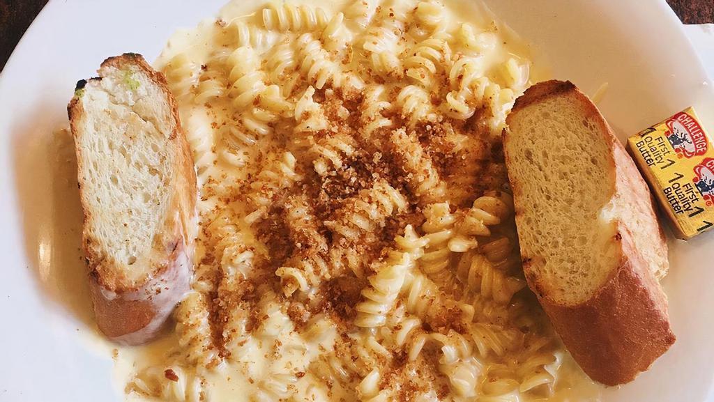 Mac N’ Cheese Pasta · Rotini Pasta in Creamy Cheddar Sauce topped with Bread Crumbs