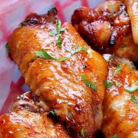 Chicken Wings · Saucy chicken wings tossed in your choice of sauce!