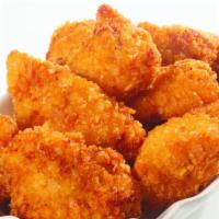 Chicken Nuggets · Breaded chicken nuggets. Comes with BBQ sauce