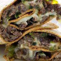 Philly Wrap · Juicy gyro slices mixed with sautéed onions, peppers, and mushrooms, topped with Swiss chees...