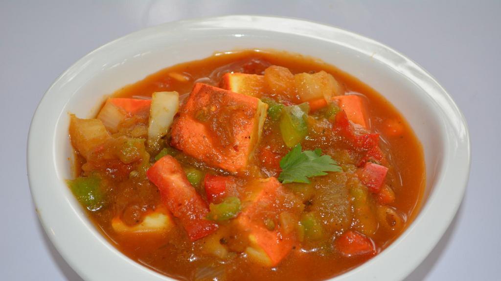 Kadai Paneer Curry · Paneer Tikka stir fried with onions, bell peppers, ginger, herbs, and spices.Served with Nan or Rice