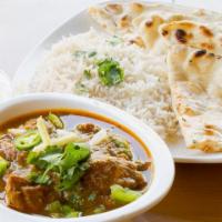 Kadai Chicken Curry  · Boneless chicken pieces stir fried with ginger, onions, bell peppers, and spices.
Served wit...
