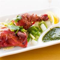 Tandoori Chicken  1 -1/2 leg only · 1 1/2 small leg or 1 big leg only marinated in yogurt and spices and baked.