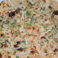 Garlic Naan(No Yogurt) · Leavened bread of fine flavor baked in a tandoor with garlic.
No yogurt served with it