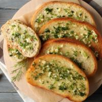 Pesto Garlic Bread · Toasted bread topped with garlic pesto, and mozzarella cheese