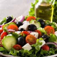 Greek Salad · Fresh romaine lettuce, feta cheese, cucumbers, tomatoes, and olives.