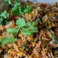 Veggie Fried Rice · Veggie fried rice with mushrooms, sansho cabbage, herbs, and spicy garlic chili paste. 
*veg...