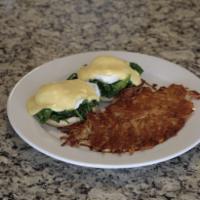 Eggs Florentina · Poached eggs and fresh spinach with hollandaise sauce on an English muffin.