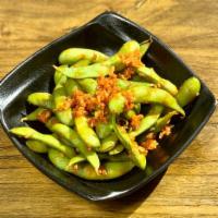 Spicy Edamame · Tossed in hot sauce with garlic and dashi sauce, spicy and savory