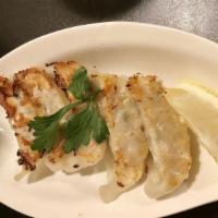 Gyoza (5 Pieces) · Dumplings filled with pork and chicken and served with dashi sauce
