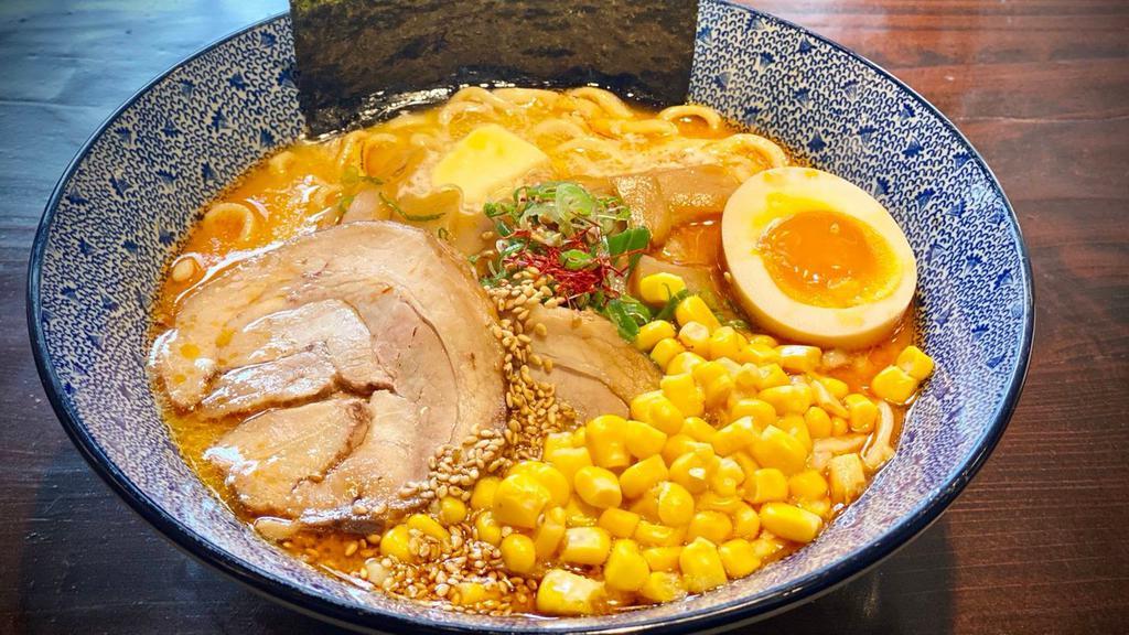 Spicy Miso Butter Corn Ramen · Wheat noodle with outstanding koshi in our spicy dashi broth flavored with miso and chicken. Topped with chashu pork, menma, ajitsuke tamago(soft-cooked egg), butter, corn, nori, green onion, sesame seeds, and red pepper.