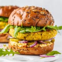 The Veggie Burger · Flavorful vegetarian burger, flame-grilled with fresh lettuce, tomatoes, onions, and house d...