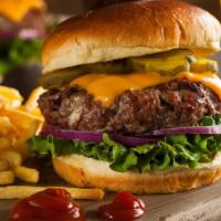 The Hamburger · Chef's exquisite hamburger made juicy, thick, flame-grilled with fresh lettuce, tomatoes and...