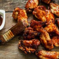 Bbq Chicken Wings  · Classic bone-in chicken wings oven baked to perfection then smothered in BBQ sauce.