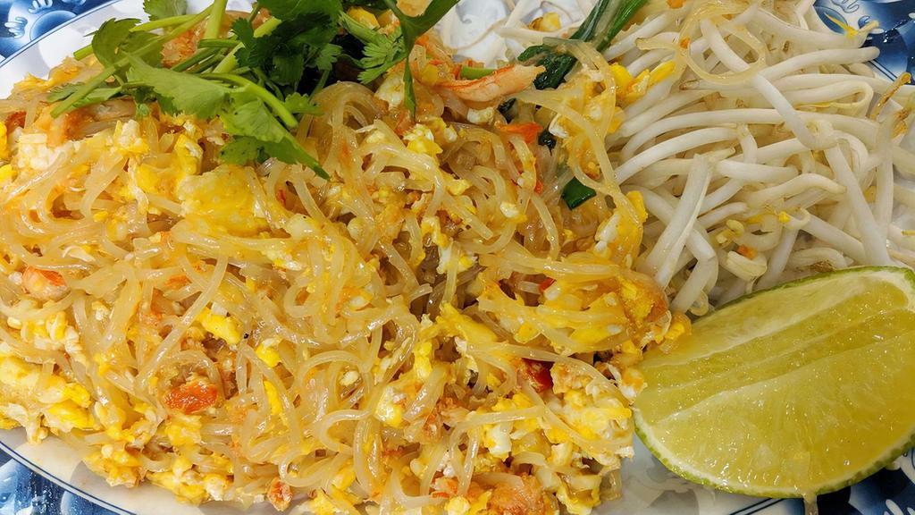 Spicy Noodles with Crab Meat · The Thai spicy rice stick noodles pan fried with minced garlic, fresh chili, eggs and crab meat.
