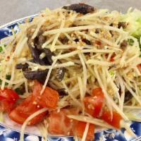 Green Papaya Salad with Salted Crab · Fine shredded green papaya tossed with salted crab, cherry tomatoes, ground peanuts, red chi...