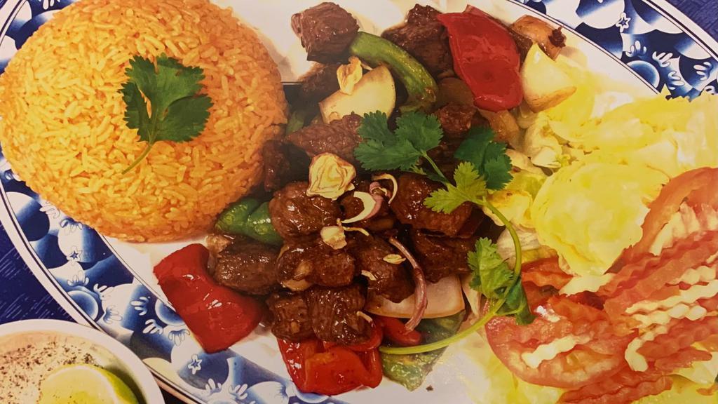 Shaking Beef (Bo Luc Lac) · Served with your choice of garlic rice and salad (classic style), macaroni, or french fries.