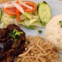 Boneless Grilled Pork Plate (Com Tam Bi Cha Thit Nuong) · Served with broken rice (com tam), shredded pork, Vietnamese egg meatloaf (cha), salad, and ...