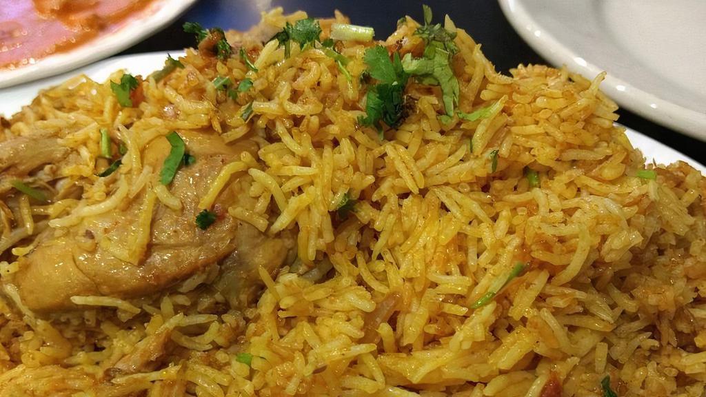 Chicken Biryani · an aromatic chicken and rice dish cooked with a blend of spices