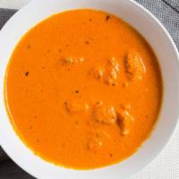 Chicken Tikka Masala (Boneless) · chicken chunks cooked in a creamy tomato and yogurt based sauce with spices