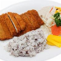 Tonkatsu · Breaded deep-fried pork cutlet served. Served with vegetables and sauce.