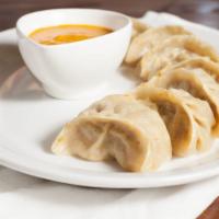 Chicken MO:MO · Hand wrapped, steamed chicken dumpling(Nepali style) served with MoMo sauce /chutney. MoMo s...