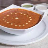Butter Chicken · Roasted dark meat chicken simmered in a butter and creamy tomato cashew sauce, in our signat...