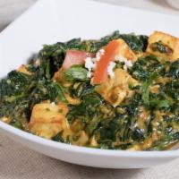Saag Paneer · Homemade cheese cooked with fresh chopped spinach and mild spices.
