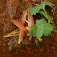 Khasi Ko Masu (Goat Curry) · Fresh tender cubes of goat with bone cooked on slow heat in traditional Nepali spices. Halal...