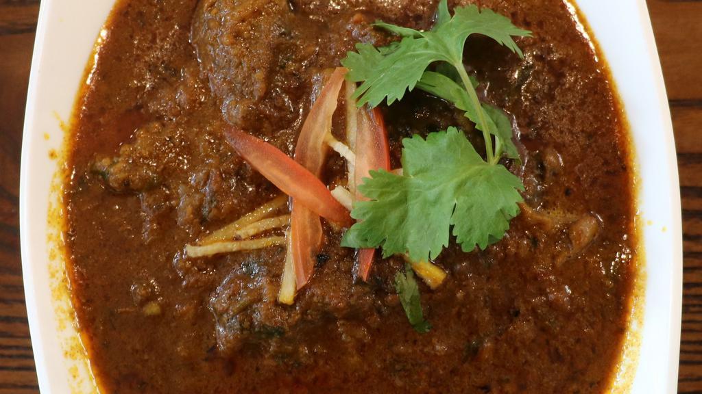 Khasi Ko Masu (Goat Curry) · Fresh tender cubes of goat with bone cooked on slow heat in traditional Nepali spices. Halal Goat.