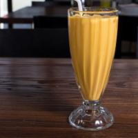 Mango Lassi · A refreshing blend of yogurt, spices and mango puree.