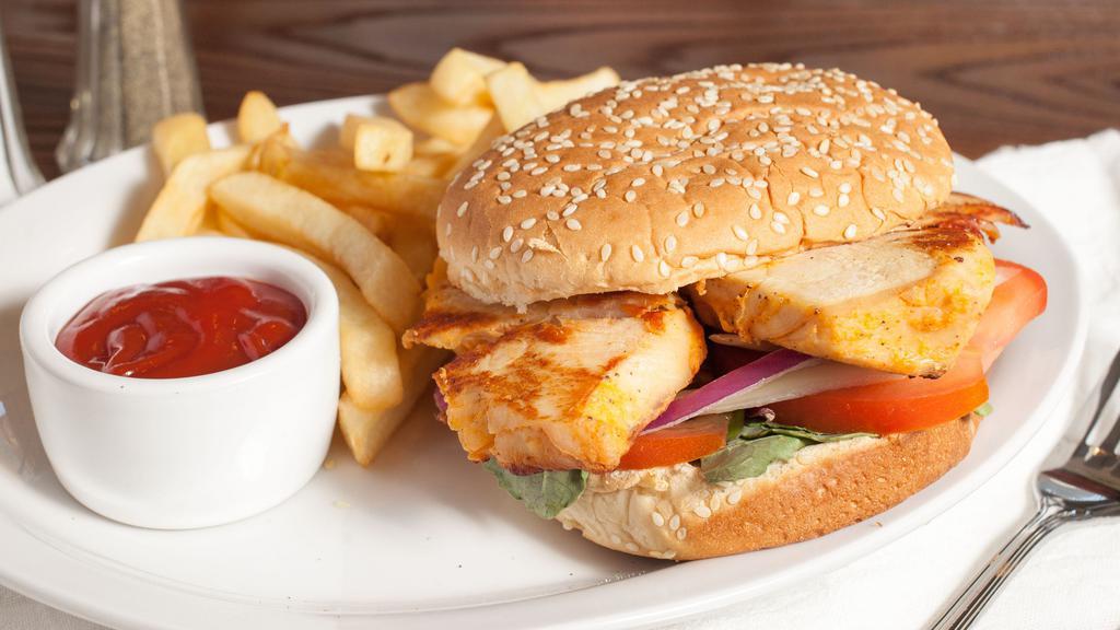 Chicken Burger with Fries · Served with grilled chicken breast,mayo, mustard,  romaine lettuce, fresh tomatoes, onions, and pickles on toasted sesame buns.