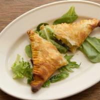 Spanakopita · Spinach and feta cheese wrapped in puff pastry