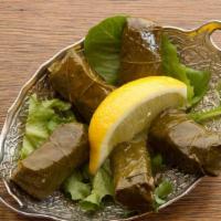 Dolma · Grape leaves stuffed with rice, assorted herbs and spices
