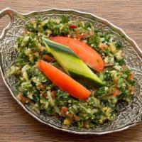 Tabuleh · Cracked wheat, tomatoes, red onion & parsley mixed with lemon juice & olive oil dressing and...