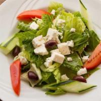 Greek Salad · Romaine lettuce, tomatoes, cucumbers, with feta cheese, olives tossed in a lemon juice and o...